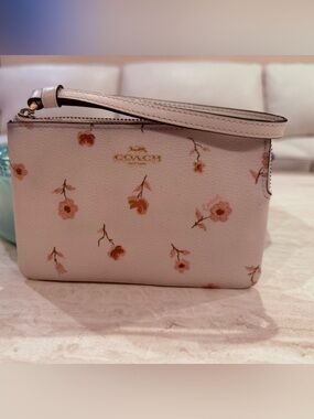 COACH Pink Floral Leather Wristlet with Gold Logo